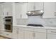 Kitchen area with stainless steel appliances, white subway tile, and white cabinets at 3351 Bristol Pl, Tarpon Springs, FL 34688