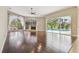 Living room with hard wood floors, fireplace, large windows and sliding doors to the pool area at 3351 Bristol Pl, Tarpon Springs, FL 34688