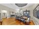 Open-concept dining room with hardwood floors and room for eight at the table at 3506 Cordgrass Dr, Valrico, FL 33596