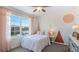 Charming bedroom filled with natural light, soft colors, and unique accents at 35112 Valley Ridge Rd, Dade City, FL 33525