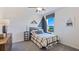 Cozy bedroom featuring a ceiling fan, window, and themed decor at 35112 Valley Ridge Rd, Dade City, FL 33525