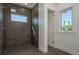 Walk-in shower featuring modern fixtures and stylish tile at 3752 Arkansas Ne Ave, St Petersburg, FL 33703
