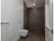 Modern bathroom with stylish fixtures, sleek shower, and a unique toilet design at 3752 Arkansas Ne Ave, St Petersburg, FL 33703