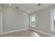 Bright bedroom featuring natural light, modern trim, and a neutral color palette at 3752 Arkansas Ne Ave, St Petersburg, FL 33703