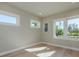 Bright bedroom with wood flooring and multiple windows at 3752 Arkansas Ne Ave, St Petersburg, FL 33703