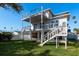 A stunning view of the rear of the house, showcasing its patio and two-story deck with metal cable railing at 3752 Arkansas Ne Ave, St Petersburg, FL 33703