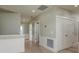 Hallway with wood floors and white trim at 3752 Arkansas Ne Ave, St Petersburg, FL 33703