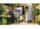 Stunning aerial view of property showcasing home, additional structure, and solar panels at 39252 Kimberly Ave, Zephyrhills, FL 33540