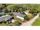Overhead aerial view showing layout of property with house, additional building, and surrounding vegetation at 39252 Kimberly Ave, Zephyrhills, FL 33540