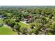 Elevated aerial image marked to show property location nestled within tree-lined surroundings and roadways at 39252 Kimberly Ave, Zephyrhills, FL 33540