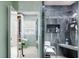 The bathroom features a tiled shower with a built-in seat and niche at 39252 Kimberly Ave, Zephyrhills, FL 33540