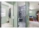 This bathroom has a tiled shower and a walk-in closet at 39252 Kimberly Ave, Zephyrhills, FL 33540