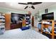 The bedroom has lots of closet space, and a TV at 39252 Kimberly Ave, Zephyrhills, FL 33540