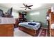 This bedroom features unique storage solutions and a classic ceiling fan at 39252 Kimberly Ave, Zephyrhills, FL 33540