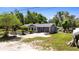 Beautifully maintained single-story home with stone accents and a large driveway shows pride of ownership at 39252 Kimberly Ave, Zephyrhills, FL 33540