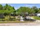Charming single-story home with a well-manicured front yard and inviting walkway offers curb appeal at 39252 Kimberly Ave, Zephyrhills, FL 33540