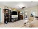 Open-concept living room with modern flooring, entertainment center, and comfortable seating creates a cozy space at 39252 Kimberly Ave, Zephyrhills, FL 33540