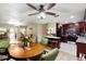 Spacious, open living space combines dining, kitchen, and living areas, perfect for modern living at 39252 Kimberly Ave, Zephyrhills, FL 33540