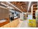 Interior of storage room with exposed ceiling and stacked boxes along the walls at 39252 Kimberly Ave, Zephyrhills, FL 33540