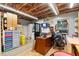 Bright storage room interior with stacked boxes, shelving and wood floor at 39252 Kimberly Ave, Zephyrhills, FL 33540