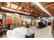 Spacious storage area with exposed ceiling and boxes stacked against the walls at 39252 Kimberly Ave, Zephyrhills, FL 33540