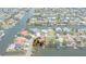 Aerial view showcasing the waterfront property location, canal access, and community layout at 4315 Flexer Dr, Hernando Beach, FL 34607