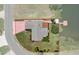 Aerial view of property highlighting its layout, landscaping and waterfront access with a private dock at 4315 Flexer Dr, Hernando Beach, FL 34607