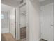 Hallway with tile flooring, multiple entryways and a white door to the right at 4315 Flexer Dr, Hernando Beach, FL 34607