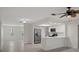 Open concept kitchen with stainless steel appliances and breakfast bar overlooking the living area at 4315 Flexer Dr, Hernando Beach, FL 34607
