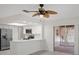 Kitchen featuring stainless steel appliances, white cabinetry and sliding door access to the patio at 4315 Flexer Dr, Hernando Beach, FL 34607
