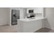 Modern kitchen featuring stainless steel appliances, white cabinets, and a breakfast bar at 4315 Flexer Dr, Hernando Beach, FL 34607
