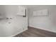 Laundry room with modern flooring and white cabinets at 4315 Flexer Dr, Hernando Beach, FL 34607