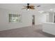 Living room with new flooring and big window for natural light at 4315 Flexer Dr, Hernando Beach, FL 34607