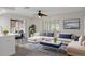 Inviting living room featuring a comfortable sectional sofa, stylish decor, and a ceiling fan at 4315 Flexer Dr, Hernando Beach, FL 34607