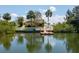 Waterfront backyard with a private dock and seating, perfect for enjoying the canal views at 4315 Flexer Dr, Hernando Beach, FL 34607