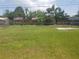 Large, well-maintained backyard with a chain-link fence at 4409 W Wyoming Ave, Tampa, FL 33616