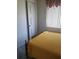 Bedroom featuring natural light and a dark wood antique bed frame at 4409 W Wyoming Ave, Tampa, FL 33616