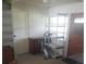 Room with shelving units, exercise equipment, and a cabinet at 4409 W Wyoming Ave, Tampa, FL 33616