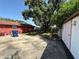 Spacious backyard featuring a concrete area and grass, with a shed for storage at 4419 Atwood Dr, Tampa, FL 33610