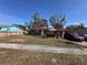 Charming single-story home with a well-maintained front yard and paved walkway at 4419 Atwood Dr, Tampa, FL 33610
