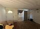 Bright living room with a couch, a window with gray curtains, and modern lighting fixtures at 4419 Atwood Dr, Tampa, FL 33610