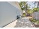Wide concrete area behind the house with fencing on one side at 4700 Chancellor Ne St, St Petersburg, FL 33703