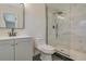 Contemporary bathroom features a glass shower, modern vanity, and matte black fixtures at 4700 Chancellor Ne St, St Petersburg, FL 33703