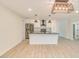 Open kitchen layout with stainless steel appliances and sleek white cabinetry at 4700 Chancellor Ne St, St Petersburg, FL 33703