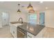 Modern kitchen with a large island, a farmhouse sink, and pendant lighting at 4700 Chancellor Ne St, St Petersburg, FL 33703