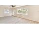 Spacious room with neutral walls, ceiling fan, and abundant natural light at 4700 Chancellor Ne St, St Petersburg, FL 33703