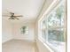 Living space featuring bright windows, neutral walls, and ceiling fan at 4700 Chancellor Ne St, St Petersburg, FL 33703