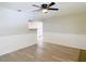 A bright living room features modern floors, wainscotting, and an open view into the kitchen at 473 Forest Ave, Brooksville, FL 34601