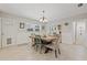 Dining area features tile floors, a rustic table, and plenty of natural light at 4805 E Regnas Ave, Tampa, FL 33617