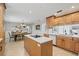 Open kitchen layout flows into the dining area, featuring custom cabinets and stainless steel appliances at 4805 E Regnas Ave, Tampa, FL 33617